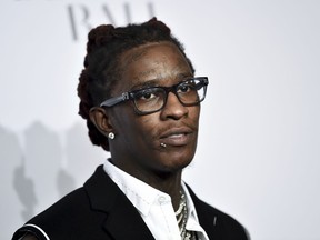 FILE - In this Sept. 14, 2017 file photo Young Thug attends the 3rd Annual Diamond Ball in New York. Police say the rapper was arrested in Los Angeles after officers found a concealed firearm inside his car. Officer Drake Madison says Friday, Aug. 17, 2018, the rapper, whose real name is Jeffery Lamar Williams, was booked on a weapons possession charge. He was being held on $35,000 bail.