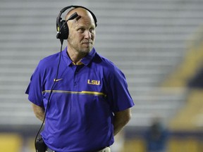 FILE - In this April 22, 2017, file photo, then-LSU offensive coordinator Matt Canada coaches in the first half of the NCAA college football team's spring game, in Baton Rouge, La. Placing a priority on player safety after the death of Jordan McNair, Maryland interim coach Matt Canada has taken significant steps to ensure that the Terrapins are poised to deal with the heat of summer. Two tents are in place at practice field to provide shade. Underneath the awnings are several fans, liquids and ice. Practice sessions have been shortened to less than two hours, with time for breaks. "The focus of our player's health and safety is No. 1, and our players are feeling that and understanding that," Canada said Wednesday, Aug. 15, 2018, before leading the team onto the field.