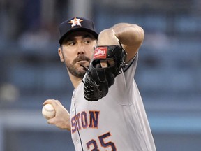 Houston Astros starting pitcher Justin Verlander throws during the first inning of the team's baseball game against the Los Angeles Dodgers on Friday, Aug. 3, 2018, in Los Angeles.