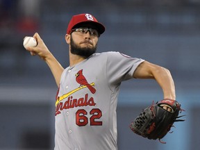 St. Louis Cardinals starting pitcher Daniel Poncedeleon throws to the plate during the first inning of a baseball game against the Los Angeles Dodgers, Tuesday, Aug. 21, 2018, in Los Angeles.