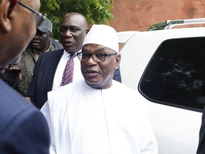 FILE - In this Sunday, Aug. 12, 2018 file photo, Malian incumbent President, Ibrahim Boubacar Keita, arrives to cast his ballot during the Presidential second round election in Bamako, Mali. Mali's President Ibrahim Boubacar Keita has won another term in a runoff election with more than 67 percent of the vote. AP Photo/Annie Risemberg, File)