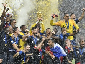 FILE - In this Sunday, July 15, 2018 file photo, France goalkeeper Hugo Lloris lifts the trophy after France won 4-2 during the final match between France and Croatia at the 2018 soccer World Cup in the Luzhniki Stadium in Moscow, Russia. World Cup winner France reclaims the No. 1 spot in the FIFA rankings for the first time in 16 years after defeating Croatia 4-2 for its second World Cup title and jumped up six places.