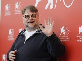 Jury President Guillermo del Toro poses for photographers at the photo call for the Jury at the 75th edition of the Venice Film Festival in Venice, Wednesday, Aug. 29, 2018.
