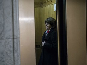 Marjory LeBreton, former leader of the government in the Senate takes the elevator after arriving on Parliament Hill in 2013.