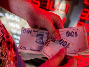 Red Zone: The lira fell as much as 12 per cent against the dollar Friday, its worst day since Turkey's financial crisis of 2001.