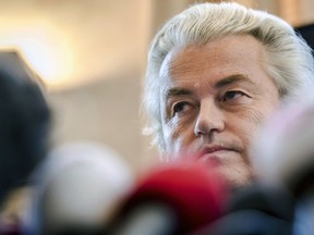 FILE - In this Friday, Nov. 3, 2017 file photo, Dutch far-right leader Geert Wilders addresses the media at the Belgian federal parliament in Brussels. The Dutch prime minister has distanced his government from a Prophet Muhammad cartoon contest being organized later this year by anti-Islam lawmaker Geert Wilders. Prime Minister Mark Rutte said Friday, Aug. 24, 2018 that Wilders "is not a member of the government. The competition is not a government initiative."