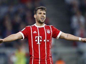 FILE - In this Saturday, April 14, 2018 file photo, Bayern's Juan Bernat reacts during the German Bundesliga soccer match between FC Bayern Munich and Borussia Moenchengladbach in Munich, Germany. Paris Saint-Germain left it late before finally making a key signing with a few hours left before the French league's transfer window closes later Friday, Aug. 31. The French champion moved in for Spanish defender Juan Bernat, who is expected to play at left back.