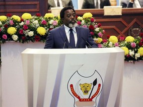 FILE - In this Thursday, July 19, 2018 file photo, Congo's President Joseph Kabila speaks during the state of the nation address to the National Assembly in Kinshasa, Democratic Republic of Congo. Congo's president is not running again in December's long-delayed elections, easing concerns by the opposition and international community that he would try to stay in power. A government spokesman on Wednesday, Aug, 8, said former interior minister Emmanuel Ramazani Shadary, the ruling party's permanent secretary, is the presidential candidate as Congo faces its first peaceful, democratic transfer of power in the country's history.