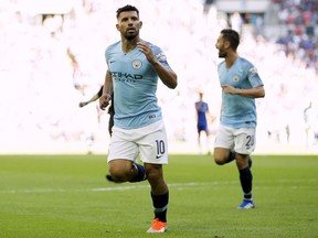 Manchester City's Sergio Aguero celebrates scoring his second goal of the game during the Community Shield soccer match between Chelsea and Manchester City at Wembley, London, Sunday, Aug. 5, 2018.