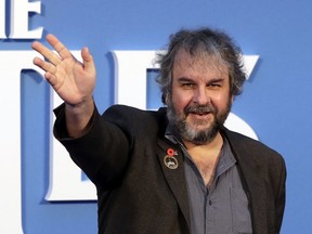 FILE - In this file photo dated Thursday, Sept. 15, 2016, film director Peter Jackson poses for photographers at the World premiere of the Beatles movie, in London. According to an announcement Tuesday Aug. 21, 2018, Jackson's new film "They Shall Not Grow Old"  a documentary that transforms grainy footage from World War I into color, will have its world premiere at the London Film Festival in October.