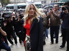 FILE - In this file photo dated Monday, Oct.2, 2017, British singer Ellie Goulding arrives at Stella McCartney's Spring-Summer 2018 ready to wear fashion collection in Paris.  A notice in the Times of London newspaper published Tuesday Aug. 7, 2018, announces the engagement of Ellie Goulding to her art dealer partner Caspar Jopling.