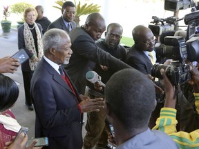 FILE - In this file photo dated Friday, July, 20, 2018,  former United Nations Secretary General Kofi Annan, left, speaks to reporters after his meeting with Zimbabwean President Emmerson Mnangagwa at State House in Harare, Zimbabwe, as the country prepares to hold elections upcoming July 30.  Annan, one of the world's most celebrated diplomats and a charismatic symbol of the United Nations who rose through its ranks to become the first black African secretary-general, has died aged 80, according to an announcement by his foundation Saturday Aug. 18, 2018.