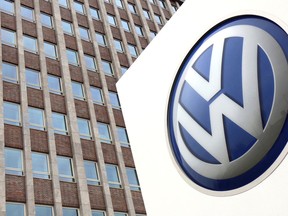 FILE - In this Friday, April 13, 2018 file photo,  Volkswagen logo is pictured in front of a company building in Wolfsburg, Germany. German carmaker Volkswagen reports second-quarter earnings on Wednesday Aug 1, 2018.