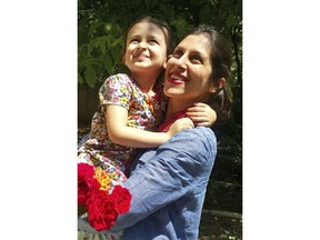 In this undated photo provided by the Free Nazanin Campaign, Nazanin Zaghari-Ratcliffe hugs her daughter Gabriella, in Iran.  Zaghari-Ratcliffe has been allowed to leave an Iranian prison for three days, her husband said Thursday, Aug. 23, 2018. Zaghari-Ratcliffe was arrested during a holiday with her toddler daughter in April 2016. Iranian authorities accuse her of plotting against the government. Her family denies this, saying says she was in Iran to visit family.(Free Nazanin Campaign/via AP)