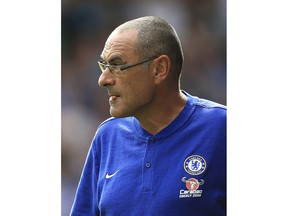 Chelsea manager Maurizio Sarri looks out from the sidelines during the Premier League match against Huddersfield, at the John Smith's Stadium in Huddersfield, England, Saturday Aug. 11, 2018.