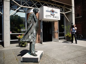 A statue of Canada's first prime minister, Sir John A. Macdonald on Aug. 8, 2018, before it was removed from in front of Victoria City Hall.