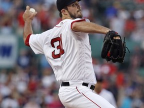 Boston Red Sox starting pitcher Drew Pomeranz delivers during the first inning of a baseball game against the Philadelphia Phillies at Fenway Park in Boston, Tuesday, July 31, 2018.