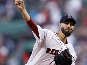 Boston Red Sox starting pitcher Rick Porcello delivers during the first inning of a baseball game against the Cleveland Indians at Fenway Park in Boston, Monday, Aug. 20, 2018.