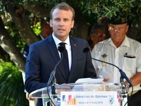 French President Emmanuel Macron delivers a speech during a ceremony marking the 74th anniversary of the liberation of Bormes-les-Mimosas during World War II, on August 17, 2017, in Bormes-les-Mimosas, southern France.President Emmanuel Macron’s government had already promised new infrastructure spending, but is coming under new pressure after Tuesday’s bridge collapse in neighbouring Italy that killed 43 people.