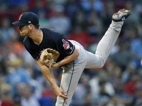 Cleveland Indians' Shane Bieber pitches during the first inning of a baseball game against the Boston Red Sox in Boston, Tuesday, Aug. 21, 2018.