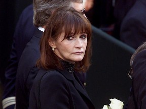 In this Oct. 3, 2000 file photo, actress Margot Kidder, who dated former Prime Minister Pierre Trudeau, arrives for his funeral at Notre-Dame Basilica in Montreal.