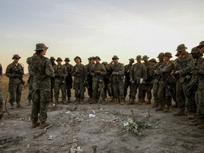 First Lt. Marina Hierl, the first woman in the Marine Corps to lead an infantry platoon, talks with the troops of Echo Company in the Mount Bundey Training Area in Australia, June 20, 2018.