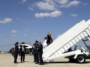 President Donald Trump and first lady Melania Trump board Air Force One for a trip to Columbus, Ohio to visit the National Children's Hospital, and to speak at the Ohio Republican State Party dinner, Friday, Aug. 24, 2018, in Andrews Air Force Base, Md.