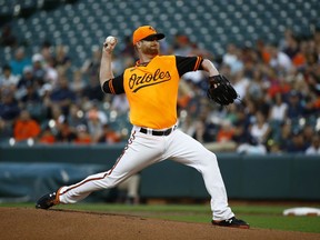 Baltimore Orioles starting pitcher Alex Cobb throws to the New York Yankees in the first inning of a baseball game, Friday, Aug. 24, 2018, in Baltimore.