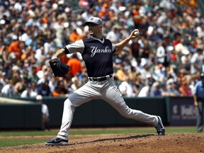 New York Yankees starting pitcher J.A. Happ throws to the Baltimore Orioles in the second inning of a baseball game, Saturday, Aug. 25, 2018, in Baltimore.