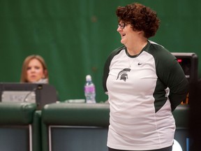 FILE - In this Feb. 19, 2016 file photo, former Michigan State University gymnastics head coach Kathie Klages reacts during the womens gymnastic's meet in East Lansing, Mich. Former Michigan State gymnastics coach Klages was charged Thursday, Aug. 23, 2018  with lying to police amid an investigation into the school's handling of sexual abuse complaints against former sports doctor Larry Nassar.