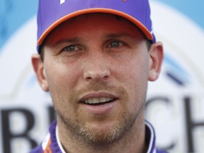 Denny Hamlin talks after winning the pole during qualifications for a NASCAR Cup Series auto race at Michigan International Speedway in Brooklyn, Mich., Friday, Aug. 10, 2018.