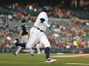 Detroit Tigers' Victor Martinez rounds first base on a two-run double in the first inning of a baseball game against the Chicago White Sox in Detroit, Tuesday, Aug. 14, 2018.