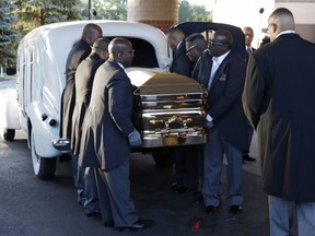 Pallbearers carry the gold casket of legendary singer Aretha Franklin after arriving at the Greater Grace Temple in Detroit, Friday, Aug. 31, 2018. Franklin died Aug. 16 of pancreatic cancer at the age of 76.