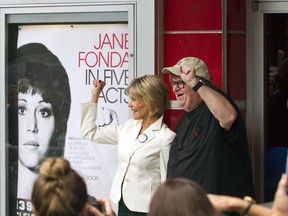 Actress Jane Fonda, left, and director Michael Moore pose for photos outside the State Theatre before the "One-on-One With Jane Fonda," panel during the Traverse City Film Festival Wednesday, Aug. 1, 2018, in Traverse City, Mich. Fonda is receiving the festival's Lifetime Achievement Award.