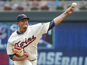 Minnesota Twins starting pitcher Adalberto Mejia throws to the Cleveland Indians in the first inning of a baseball game Wednesday, Aug. 1, 2018, in Minneapolis.