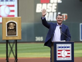 Former Minnesota Twins player Jim Thome waves to the crowd as he is introduced during ceremonies to honor him after his recent induction into the National Baseball Hall of Fame prior to a baseball game against the Oakland Athletics, Saturday, Aug. 25, 2018, in Minneapolis.