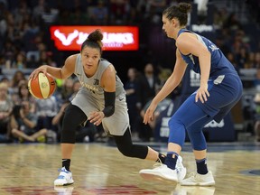 FILE - In this July 13, 2018, file photo, Las Vegas Aces guard Kayla McBride drives against Minnesota Lynx forward Cecilia Zandalasini (9) during the second half of a WNBA basketball game in Minneapolis. The Aces had an adventure getting to Washington for their game against the Mystics on Friday night.