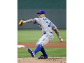 Making his major league debut, Toronto Blue Jays pitcher Sean Reid-Foley throws in the first inning of a baseball game against the Kansas City Royals at Kauffman Stadium in Kansas City, Mo., Monday, Aug. 13, 2018.