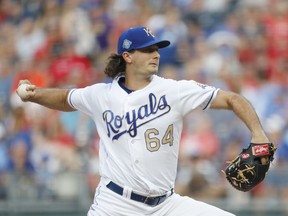 Kansas City Royals pitcher Burch Smith throws to a St. Louis Cardinals batter in the first inning of a baseball game at Kauffman Stadium in Kansas City, Mo., Friday, Aug. 10, 2018.