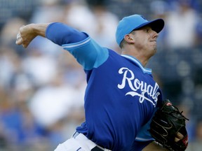 Kansas City Royals starting pitcher Heath Fillmyer throws during the first inning of the team's baseball game against the Cleveland Indians on Saturday, Aug. 25, 2018, in Kansas City, Mo.