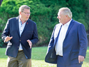 Saskatchewan Premier Scott Moe, left, and Ontario Premier Doug Ford at a meeting of Canadian premiers on July 18, 2018. The two agreed to fight the federal government plan to impose a carbon tax.