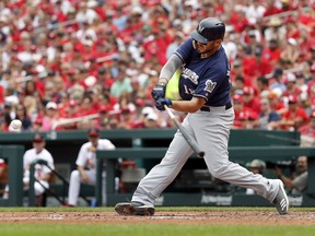 Milwaukee Brewers' Mike Moustakas hits a two-run double during the third inning of a baseball game against the St. Louis Cardinals, Sunday, Aug. 19, 2018, in St. Louis.