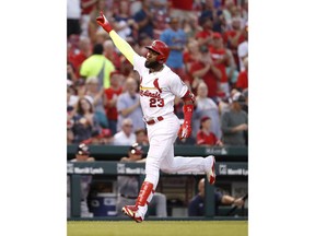 St. Louis Cardinals' Marcell Ozuna celebrates after hitting a solo home run during the second inning of the team's baseball game against the Washington Nationals on Wednesday, Aug. 15, 2018, in St. Louis.