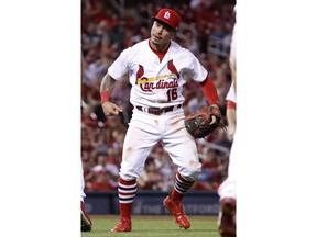 St. Louis Cardinals second baseman Kolten Wong celebrates after throwing Milwaukee Brewers' Keon Broxton out at first during the eighth inning of a baseball game Friday, Aug. 17, 2018, in St. Louis.