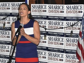 Sharice Davids addresses her supporters at Breit's Stein and Deli in Kansas City, Kan., Tuesday, Aug. 7, 2018. Davids, a Democrat, is running for a seat in Kansas' 3rd Congressional District.