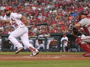 St. Louis Cardinals' Matt Carpenter (13) drops his bat after bunting as Washington Nationals catcher Matt Wieters looks on in the first inning of a baseball game, Monday, Aug. 13, 2018, in St. Louis.