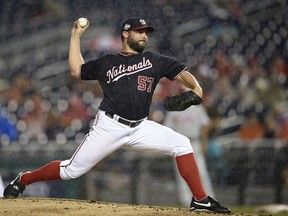 Washington Nationals starting pitcher Tanner Roark delivers a pitch during the third inning of a baseball game against the Philadelphia Phillies, Tuesday, Aug. 21, 2018, in Washington.