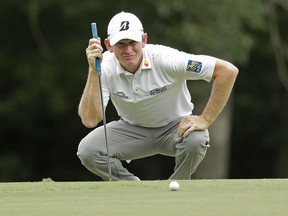 Brandt Snedeker lines up a putt on the first hole during the third round of the Wyndham Championship golf tournament at Sedgefield Country Club in Greensboro, N.C., Saturday, Aug. 18, 2018.