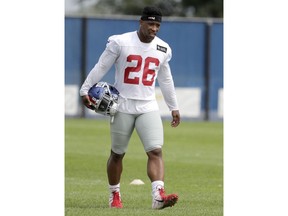 New York Giants running back Saquon Barkley works out individually while the rest of the team works out together during NFL football training camp, Tuesday, Aug. 21, 2018, in East Rutherford, N.J.