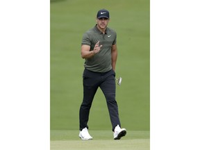 Brooks Koepka acknowledges the gallery after chipping on the 14th hole during the first round of the Northern Trust golf tournament, Thursday, Aug. 23, 2018, in Paramus, N.J.
